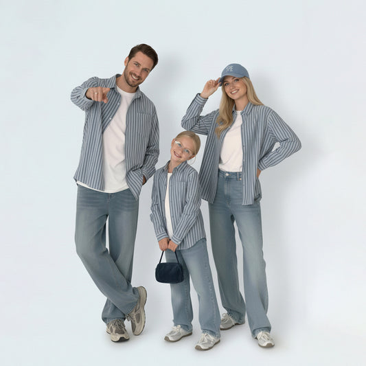 Full family in matching family outfits featuring timeless striped cotton shirts for a coordinated weekend look.