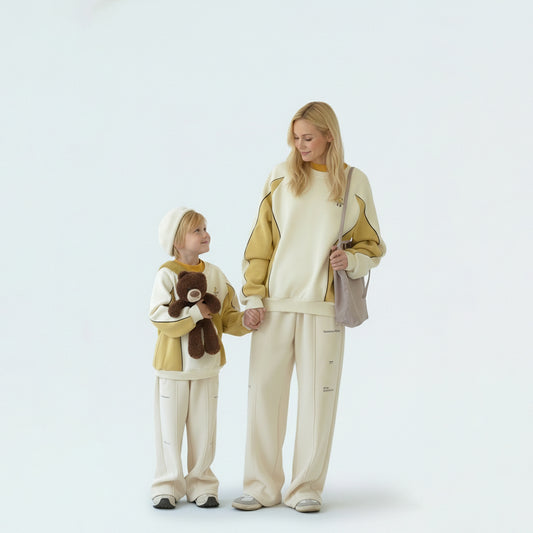 A cozy family bonding moment in coordinated winter outfits with warm fleece lining.