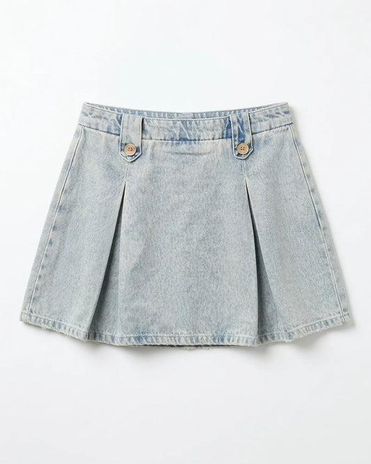 Front view flat lay of 100 percent cotton light blue denim pleated skirt with decorative buttons.