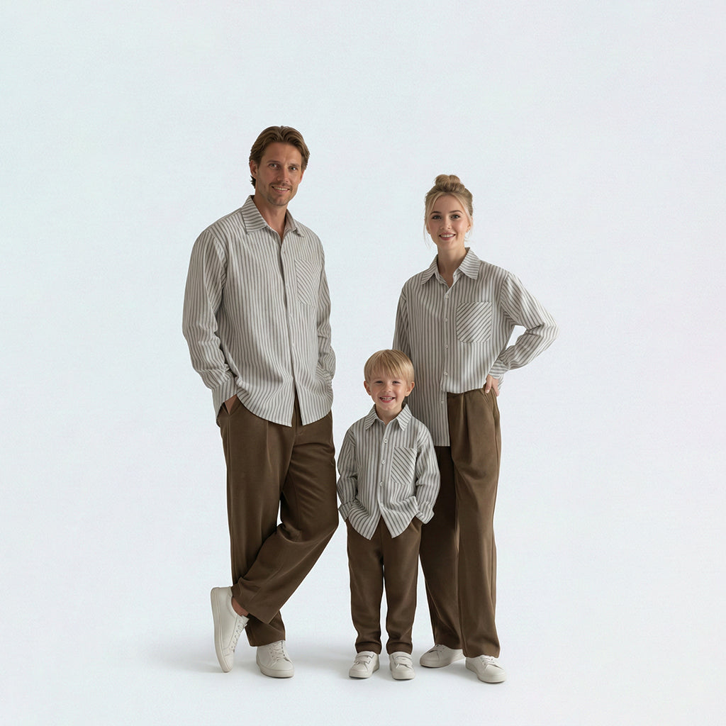 Full family in matching family outfits wearing blue striped cotton shirts for a coordinated Japanese style look.
