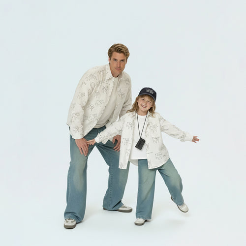 Father and daughter bonding in matching family outfits, wearing comfortable and breathable sheep print cotton shirts.