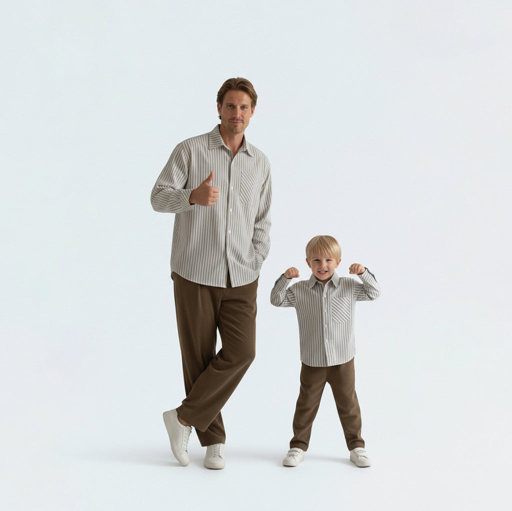 Father and son bonding in matching family outfits wearing comfortable and non-deforming blue striped cotton shirts.