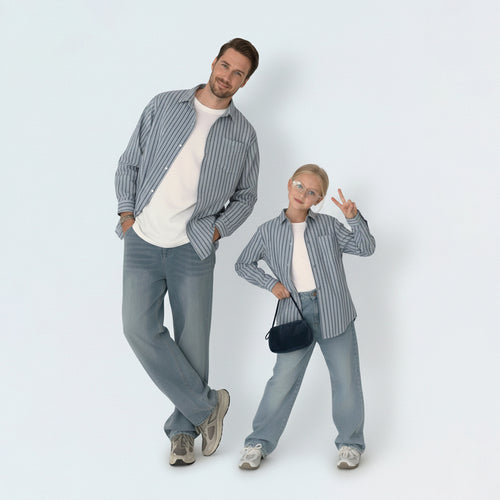 Dad and son bonding in matching family outfits, wearing smart striped shirts for a cool Aussie outdoor lifestyle.