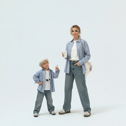 Mother and son in matching family outfits showcasing the stylish sky blue striped cotton shirt mini-me travel style.