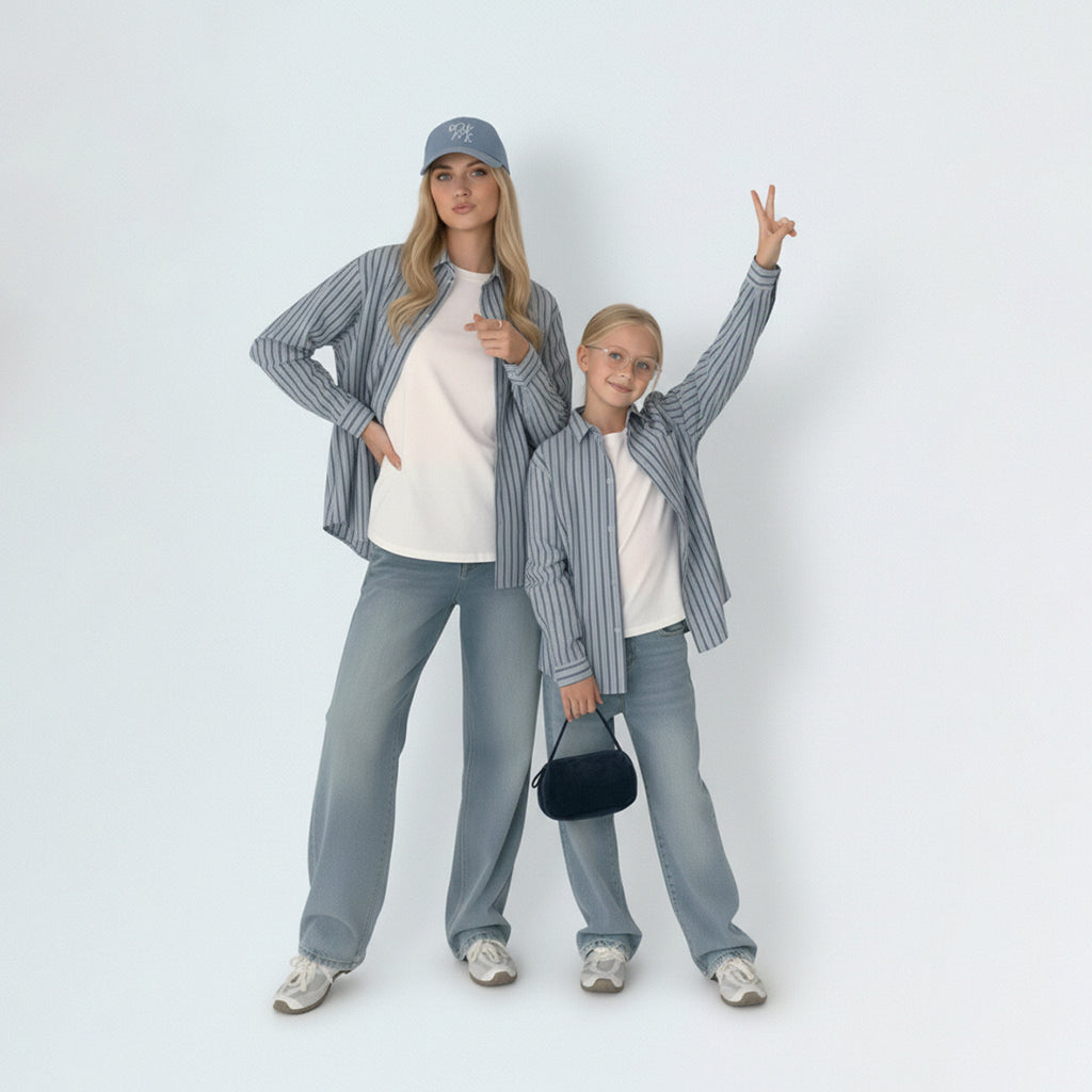 Mother and daughter in matching family outfits, showcasing the stylish mini me look in light blue striped cotton.