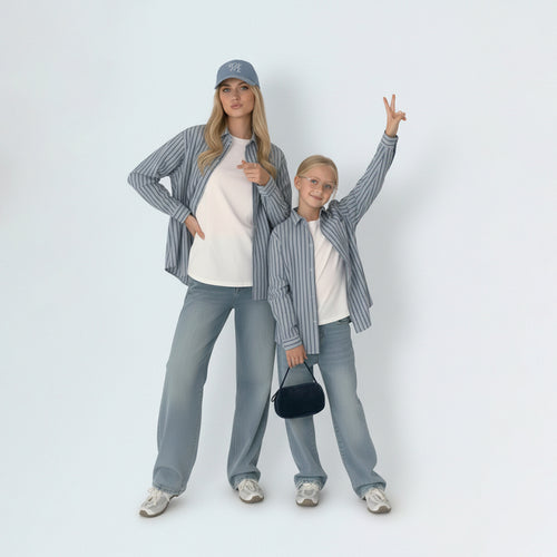 Mother and daughter in matching family outfits, showcasing the stylish mini me look in light blue striped cotton.