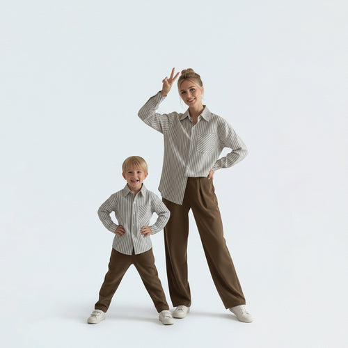 Mother and son in matching family outfits showcasing the elegant blue striped cotton shirt mini-me travel style.