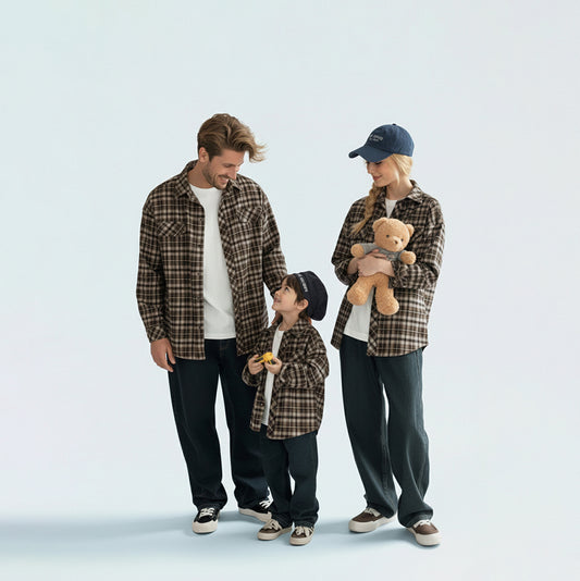 Photo-ready family in matching family outfits, ideal for coordinated rustic family portraits or outdoor reunions.