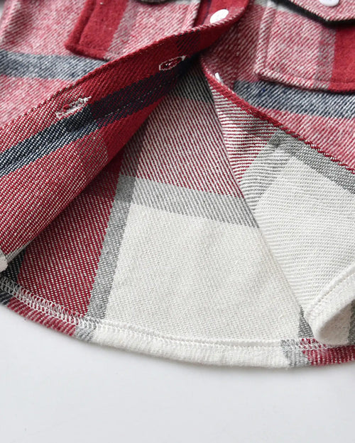 Detailed shot of the functional chest pocket and adjustable cuffs on our matching family outfits flannel shirt.