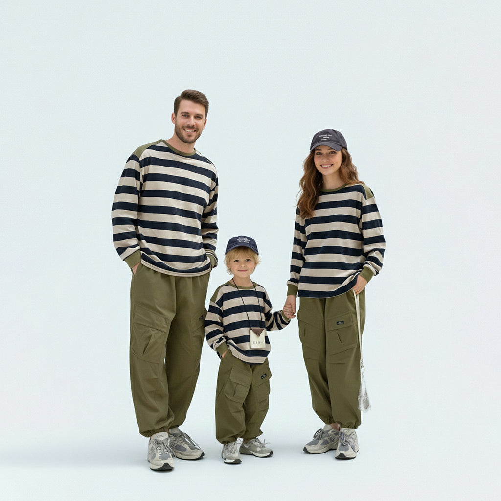 Coordinated family in matching family outfits, perfect for a casual outdoor weekend or school run.
