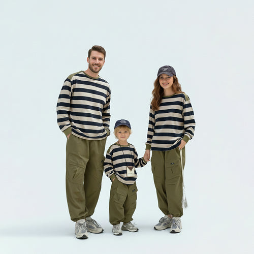 Coordinated family in matching family outfits, perfect for a casual outdoor weekend or school run.
