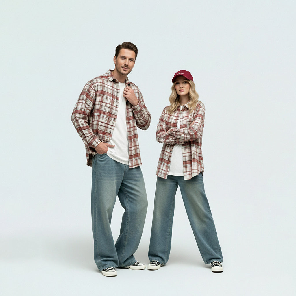 Parents in coordinated matching family outfits featuring the unisex red plaid brushed cotton shirt.