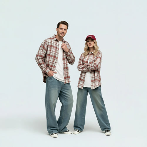 Parents in coordinated matching family outfits featuring the unisex red plaid brushed cotton shirt.