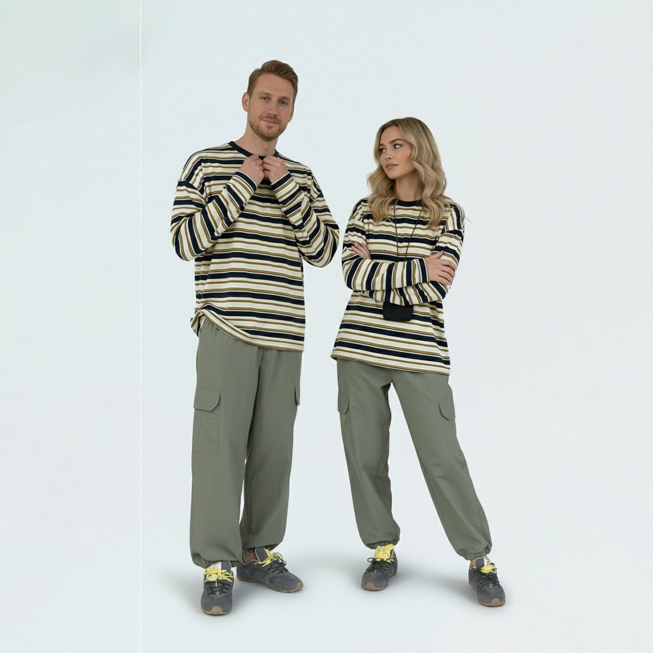Couple in matching family outfits featuring the unisex contrast striped long sleeve knit tee.